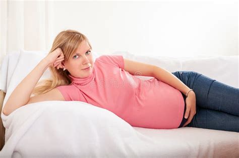 Pregnant Woman Relaxing At Home On The Couch Stock Image Image Of Body Life 70804313