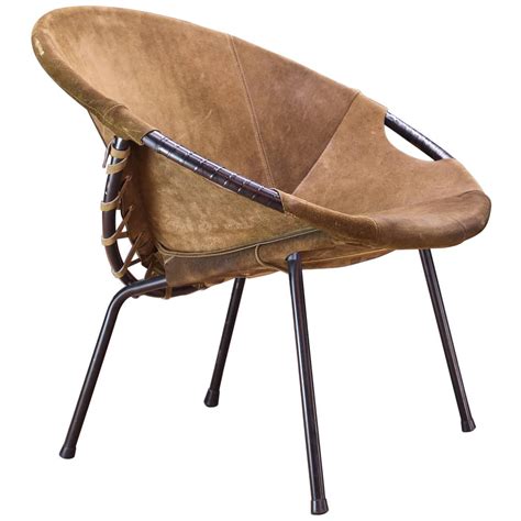 This leather sling chair is timeless beauty inspired by the pioneers of style. Mid-Century Lusch Circle Chair Olive Brown Suede Leather ...