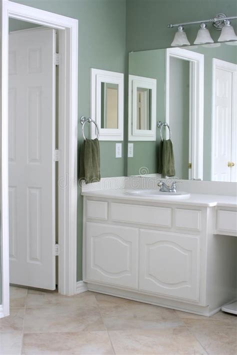 I can't afford to change that out. Bathroom With White Cabinets And Trim Stock Image - Image ...