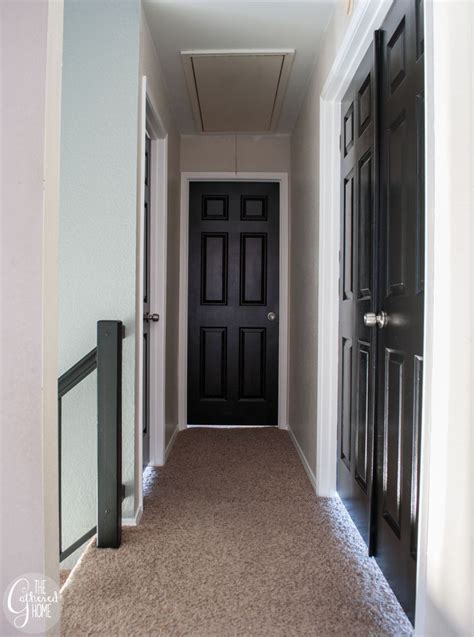 Line the edges of the closet door trim with painter's tape to protect the surrounding wall. Black Interior Doors - The Gathered Home