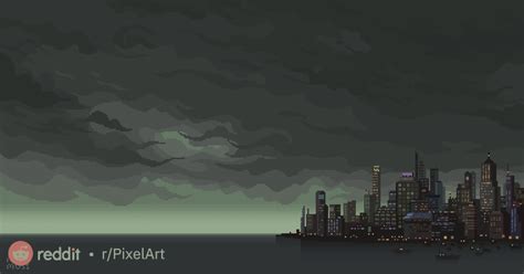 The City Is Lit Up At Night With Dark Clouds