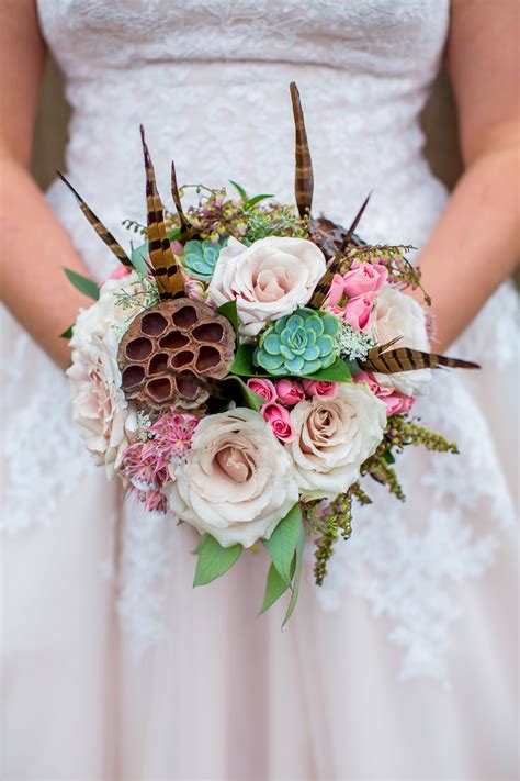 12 unique wedding bouquet ideas with feathers emmalovesweddings. Summer bridal bouquet of pheasant feathers, succulents ...