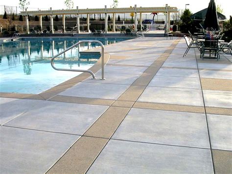 Concrete is made up of various forms of rock, sand, gravel and water. Alternating broom finish and Sandscape on this community's ...