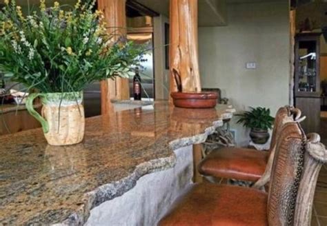 This kitchen island is made of welded steel and silvered alder wood, topped with a concrete work surface. 45 Unique Kitchen Countertops Of Different Materials ...