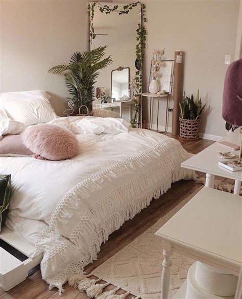No boho bedroom is complete without tons of colorful, patterned pillows. simple bedroom with boho vibes and a neutral colour scheme ...