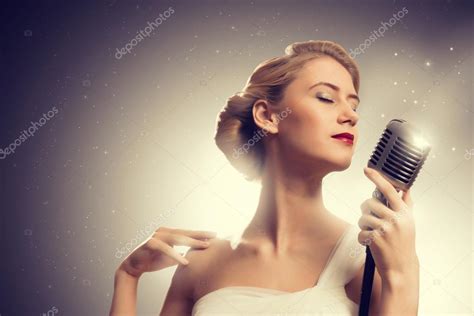 Attractive Female Singer With Microphone — Stock Photo © Khakimullin