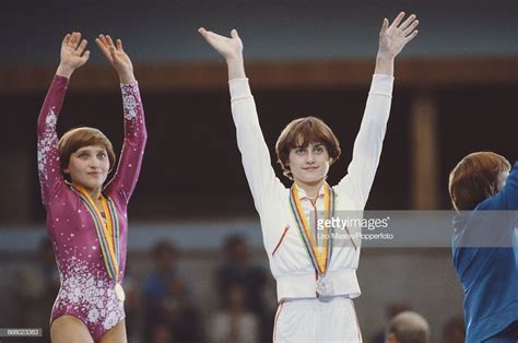 Russian gymnast Yelena Davydova (left), competing for the ...