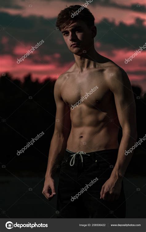 Young Adult Male Posing Shirtless Sunset Stock Photo By ©triumph0828