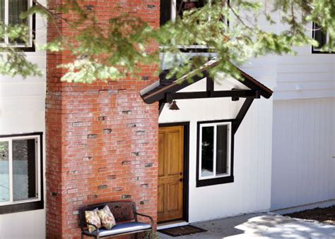 Creating an exterior paint scheme. White, black trim, brick chimney | White exterior houses ...