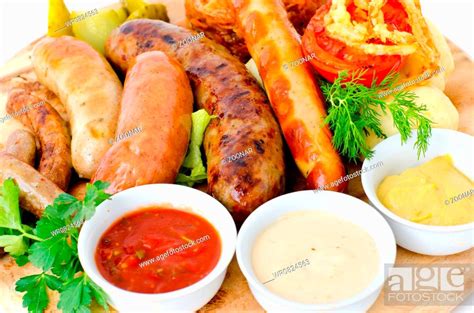 Various Sausages With Sauces Stock Photo Picture And Royalty Free