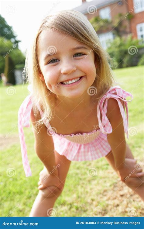 Portrait Of Young Girl Standing In Garden Stock Image Image 26103083