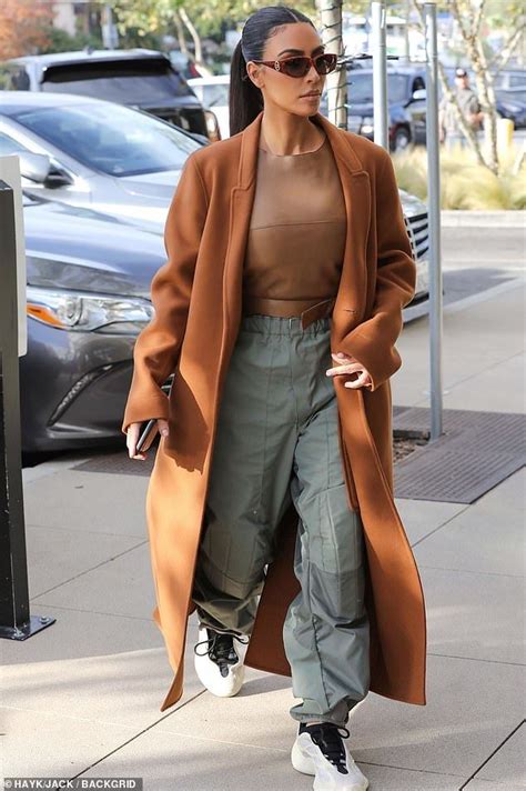 Kim Kardashian Owns Christmas Eve In Chic Burnt Orange As She Finishes Last Minute Shopping In