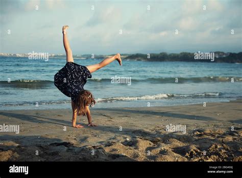 Girl Doing A Handstand On The Beach Bulgaria Stock Photo Alamy