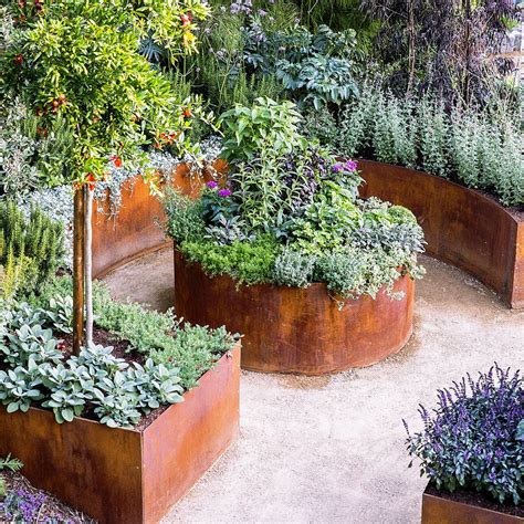 Woodlogger's affordable raised garden bed idea is an excellent project for homeowners and gardeners with a lot of unused this garden bed uses corrugated metal and pressure treated wood. 15 Raised Bed Garden Design Ideas