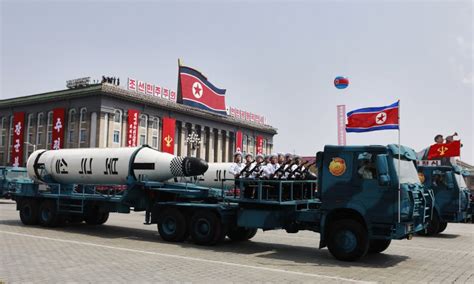 north korea displays new missiles in military parade