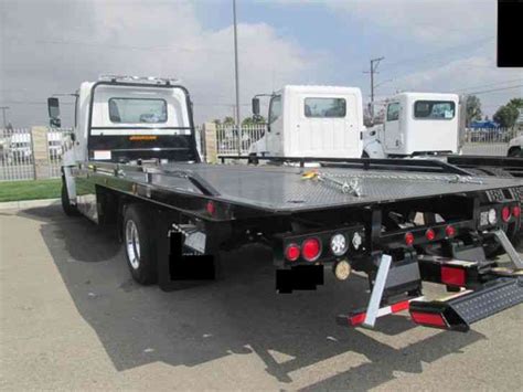 Maybe you would like to learn more about one of these? Hino 258ALP TOW TRUCK -21FT JERRDAN FLATBED BED - AIR RIDE ...