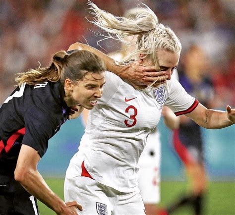 Tobin Heath Uswnt Pushes Off An Opposing Player In Pursuit Of The