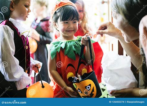Little Children Trick Or Treating On Halloween Stock Photo Image Of