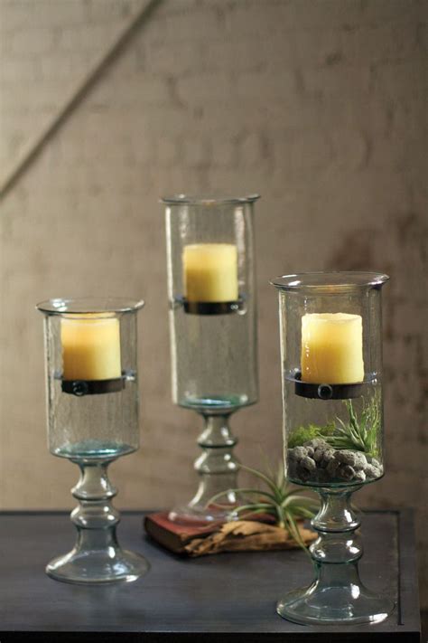 Crafted to make an impression, these candle sconces feature bold, black iron bases that beautifully wrap around cylindrical glass hurricanes. Kalalou Cylinder Glass With Metal Insert Votive Candle ...