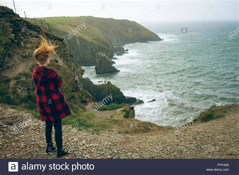 Redhead Woman Standing Near Beach Stock Photo Alamy