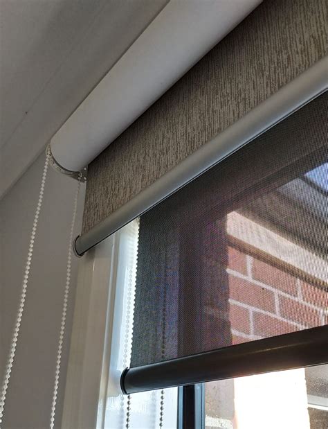 An easy way to keep the blinds on your door from swinging is by using hold down brackets to keep them in place. Double Roller Blinds - The Ultimate Guide - Melbourne