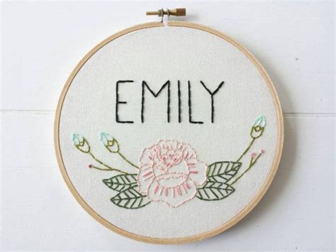 Create a custom baby name embroidery hoop using this free floral embroidery pattern and tutorial. Custom Name Embroidery Hoop Art, Floral Rose Art, Hand ...