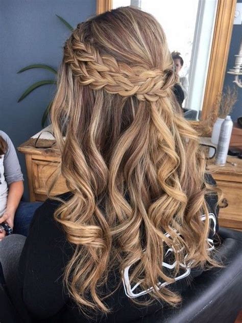 A loose curly updo with a fishtail braid is a great idea for a boho bride. 20 Brilliant Half Up Half Down Wedding Hairstyles for 2019 ...