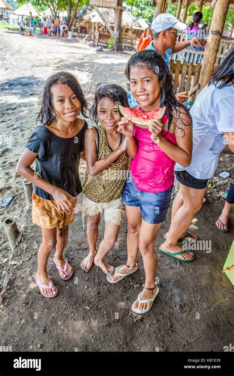 Three Young Filipino Girls At The Beach Eating Watermelon In Ormoc City