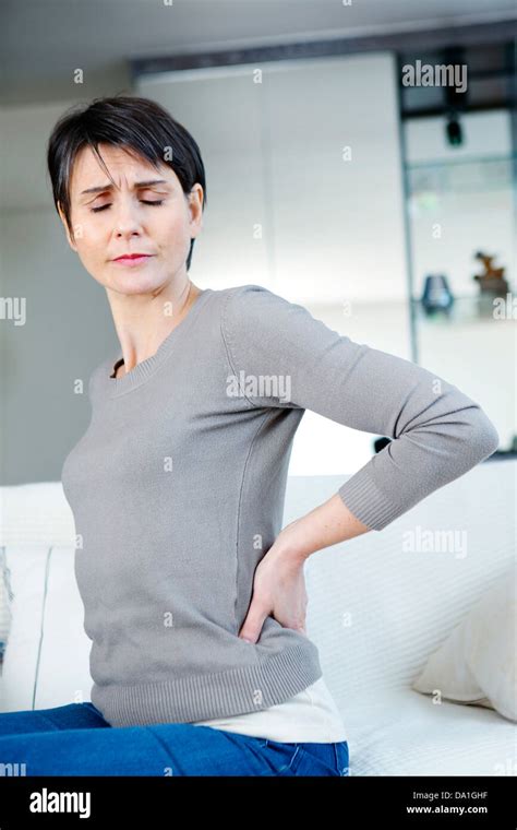 Lower Back Pain In A Woman Stock Photo Alamy