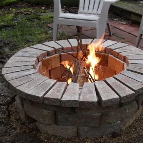 An Outdoor Fire Pit With Chairs Around It