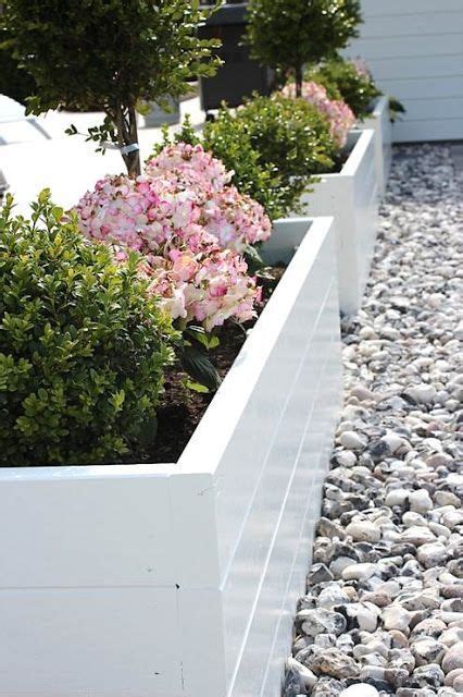 White Painted Raised Beds Surrounded By Gravel Lovely Gardening For