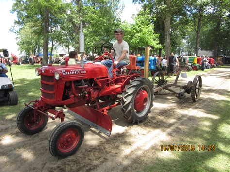 Farmall Cub With Mower In Tow Farmall Tractors Old Tractors Antique