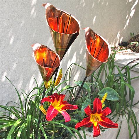 Being a malleable metal, copper is a favorite for. copper lily garden sculptures by london garden trading | notonthehighstreet.com
