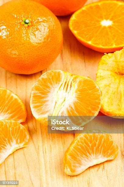 Mandarin Orange Sections On Cutting Board Stock Photo Download Image