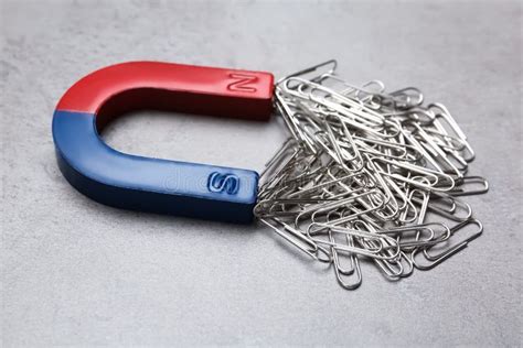 Magnet Attracting Paper Clips Stock Photo Image Of Bond Movement