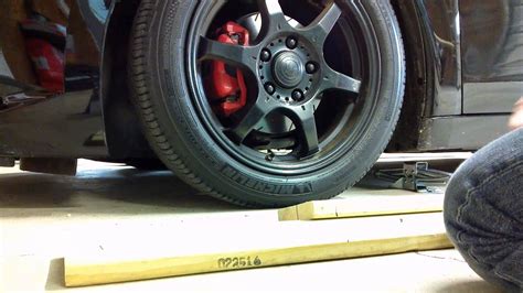 Rental car the nuts had been tightened with a impact wrech, and there was no way the small wrench in the tool kit was going to loosen them. Lowered Car ramp for a flat tire - YouTube