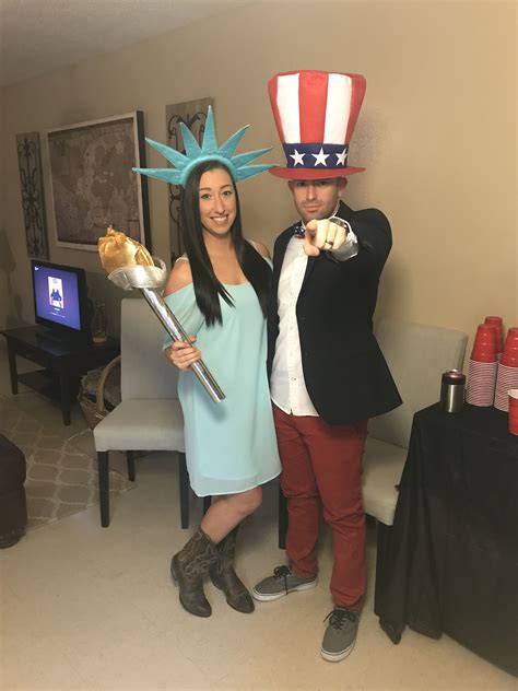 The fake warrior statue is holding a shovel; Lady liberty and Uncle Sam, Statue of Liberty, couples costumes, Halloween costumes, group ...