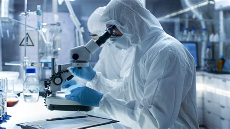 In A Secure High Level Laboratory Scientists In A Coverall Conducting A