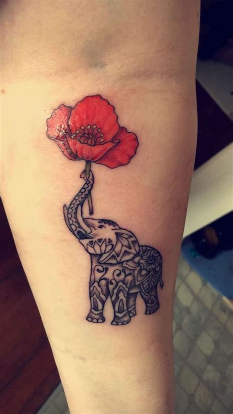 Elephant Holding A Poppy Tattoo Elephant Tattoo Small