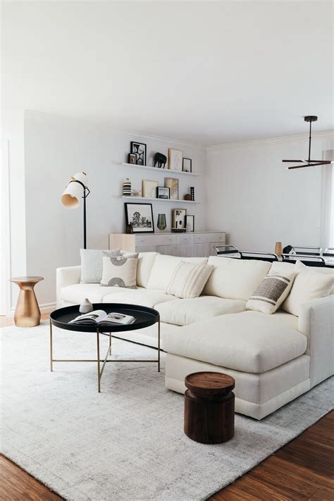 Does your child have a large selection of toys and books? White linen sectional couch // Dining Room Shelving with ...