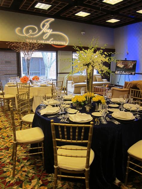 A Banquet Room Set Up With Tables And Chairs