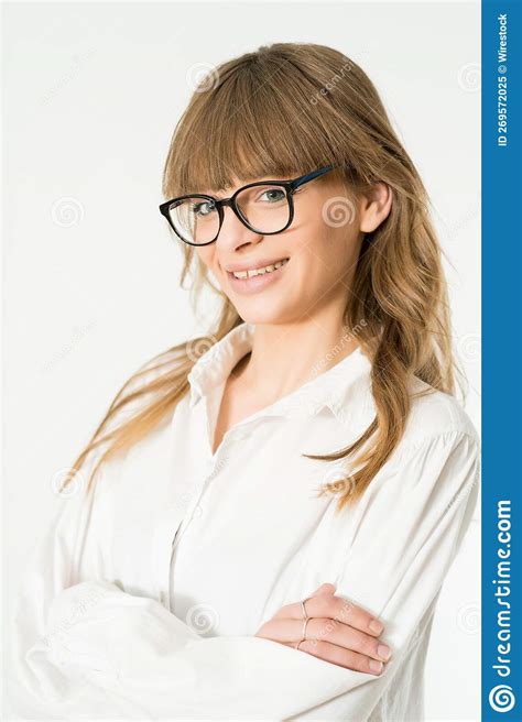 A Pretty Blonde Woman In A White Shirt And Glasses With Her Arms