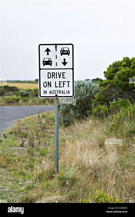 Traffic Warning Sign Advising Drivers To Drive On Left Side Of Road