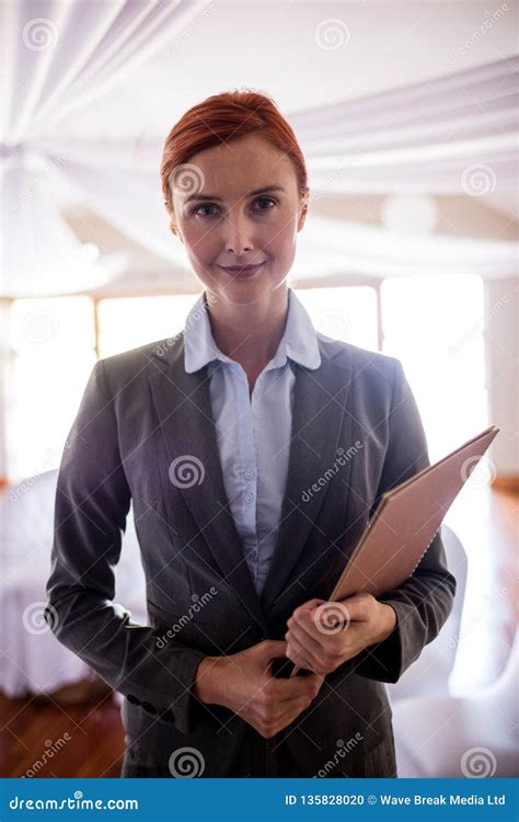 Female Manager Standing With File In Hotel Stock Photo Image Of