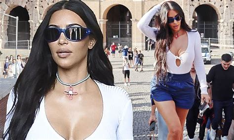 kim kardashian rocks a white bodysuit with shorts on a tour of colosseum in rome with her glam squad