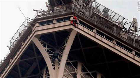 man caught climbing the eiffel tower akipress news agency