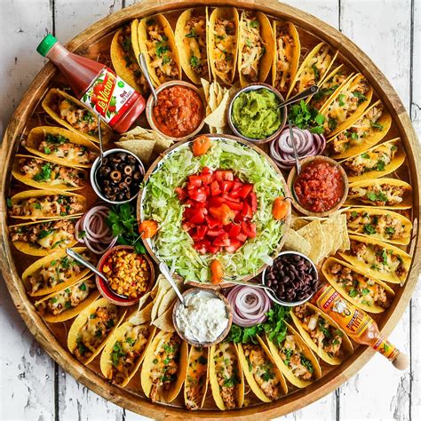 I love throwing parties and inviting guests over to play games. Easy Taco Recipe Dinner Board #tacos #tacoboard #easytacos ...