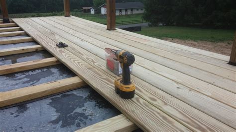 So long as moisture does not get behind the metal wall to rot the wooden it's attached to. Great Install Composite Decking Over Concrete