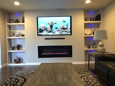 We use an electric dimplex flame unit in most of our fireplaces, and they pump out a surprising amount of heat for their size. Blue lights under my wall unit with electric fireplace # ...