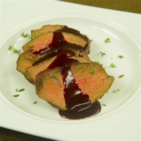 This beef tenderloin roast is coated with a simple blend of salt, pepper and garlic and served with a chunk sauce made with mushrooms and port wine. Beef Tenderloin with Chocolate Chili Sauce